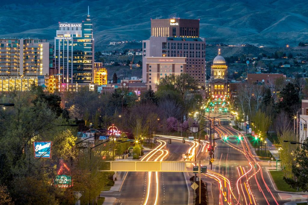 Colorful urban traffic at night in Boise, Idaho by Alden Skeie